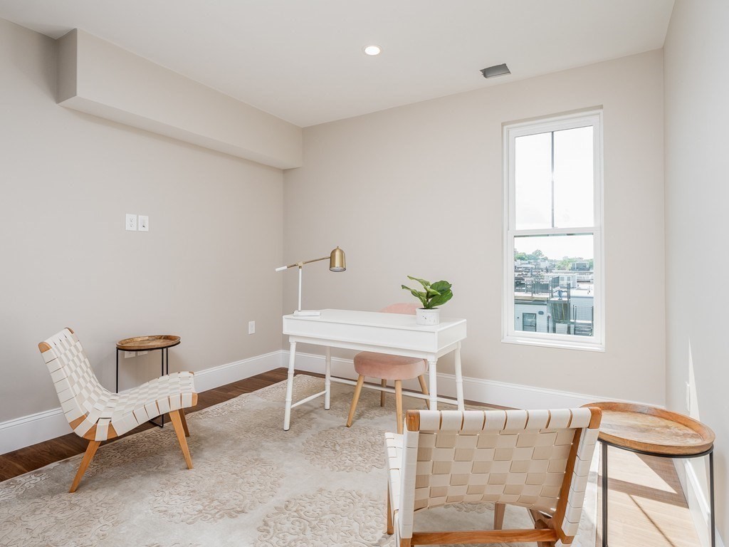 45 L Street, Unit 20 Boston, MA 02127 - Photo 18 of 28 a work room with furniture and a window