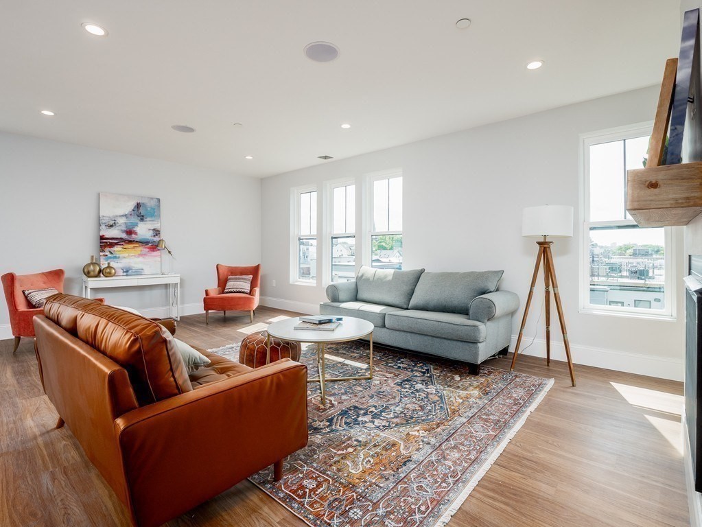 45 L Street, Unit 20 Boston, MA 02127 - Photo 3 of 28 a living room with furniture and a rug