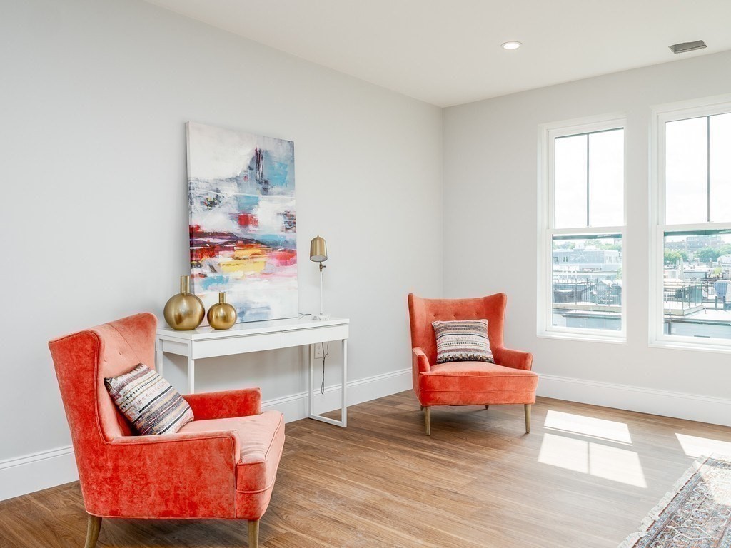 45 L Street, Unit 20 Boston, MA 02127 - Photo 4 of 28 a living room with furniture and a window