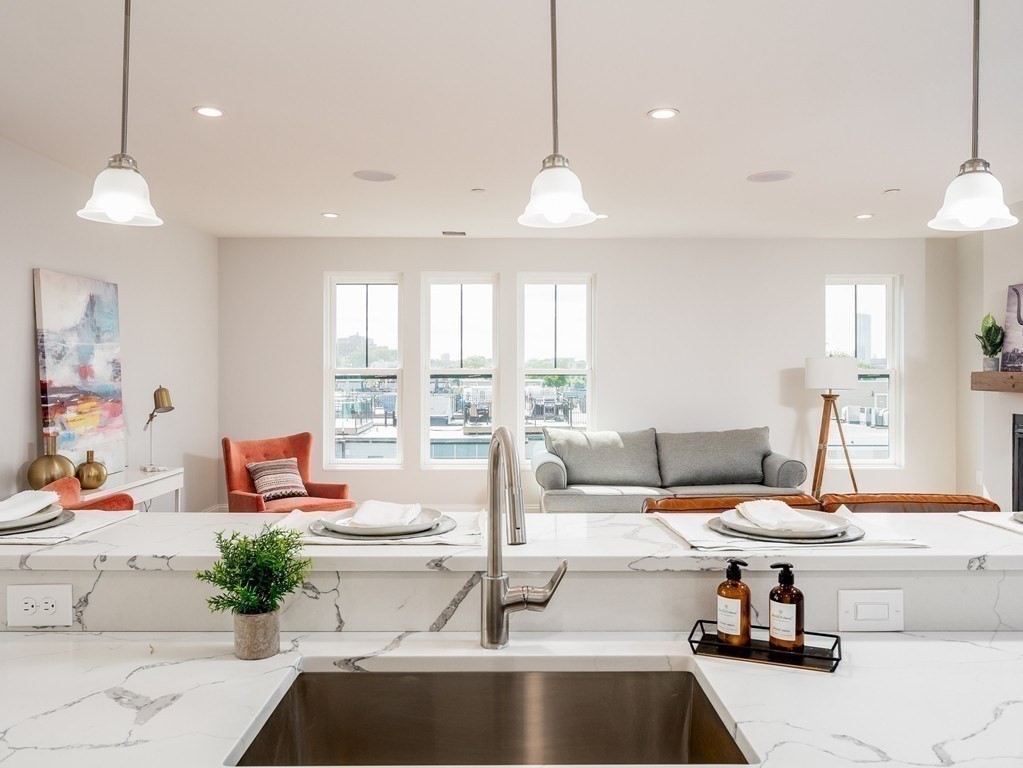 45 L Street, Unit 20 Boston, MA 02127 - Photo 10 of 28 a outdoor kitchen with a large window and stainless steel appliances