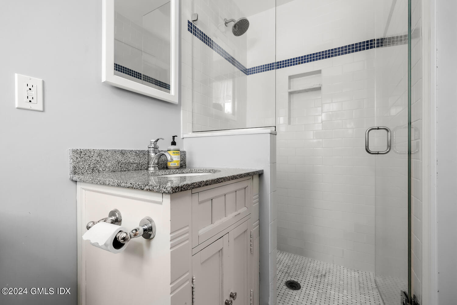 28 Juniper Lane Riverside, CT 06878 - Photo 12 of 22 a bathroom with a granite countertop sink a shower and a mirror