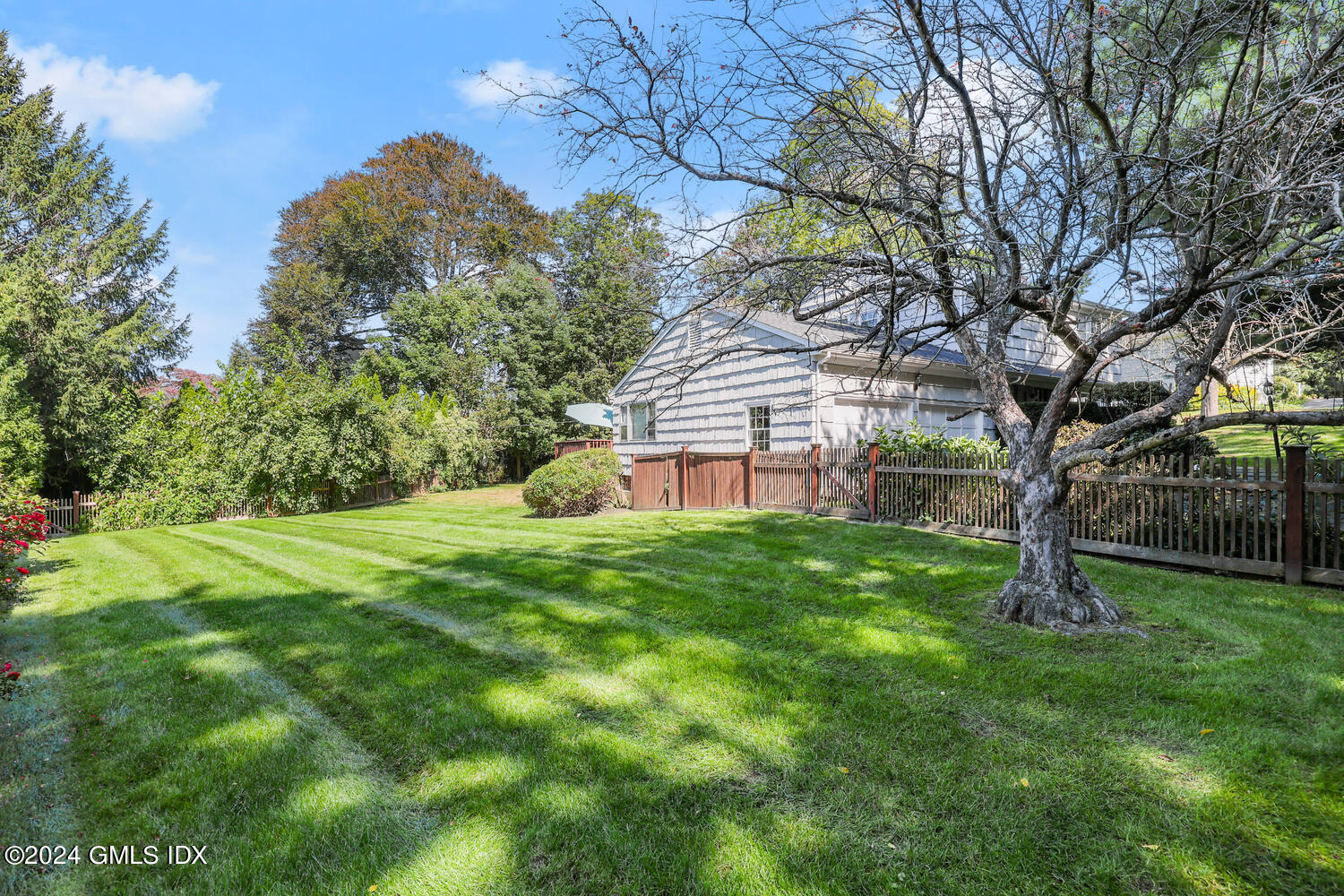 28 Juniper Lane Riverside, CT 06878 - Photo 18 of 22 a view of a backyard with large trees