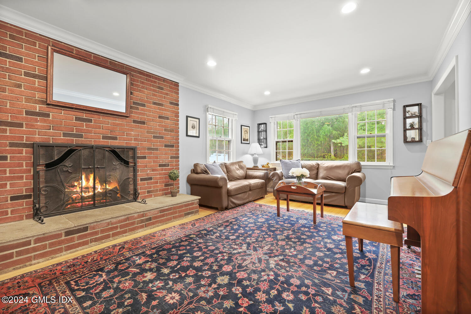 28 Juniper Lane Riverside, CT 06878 - Photo 2 of 22 a living room with furniture and a fireplace