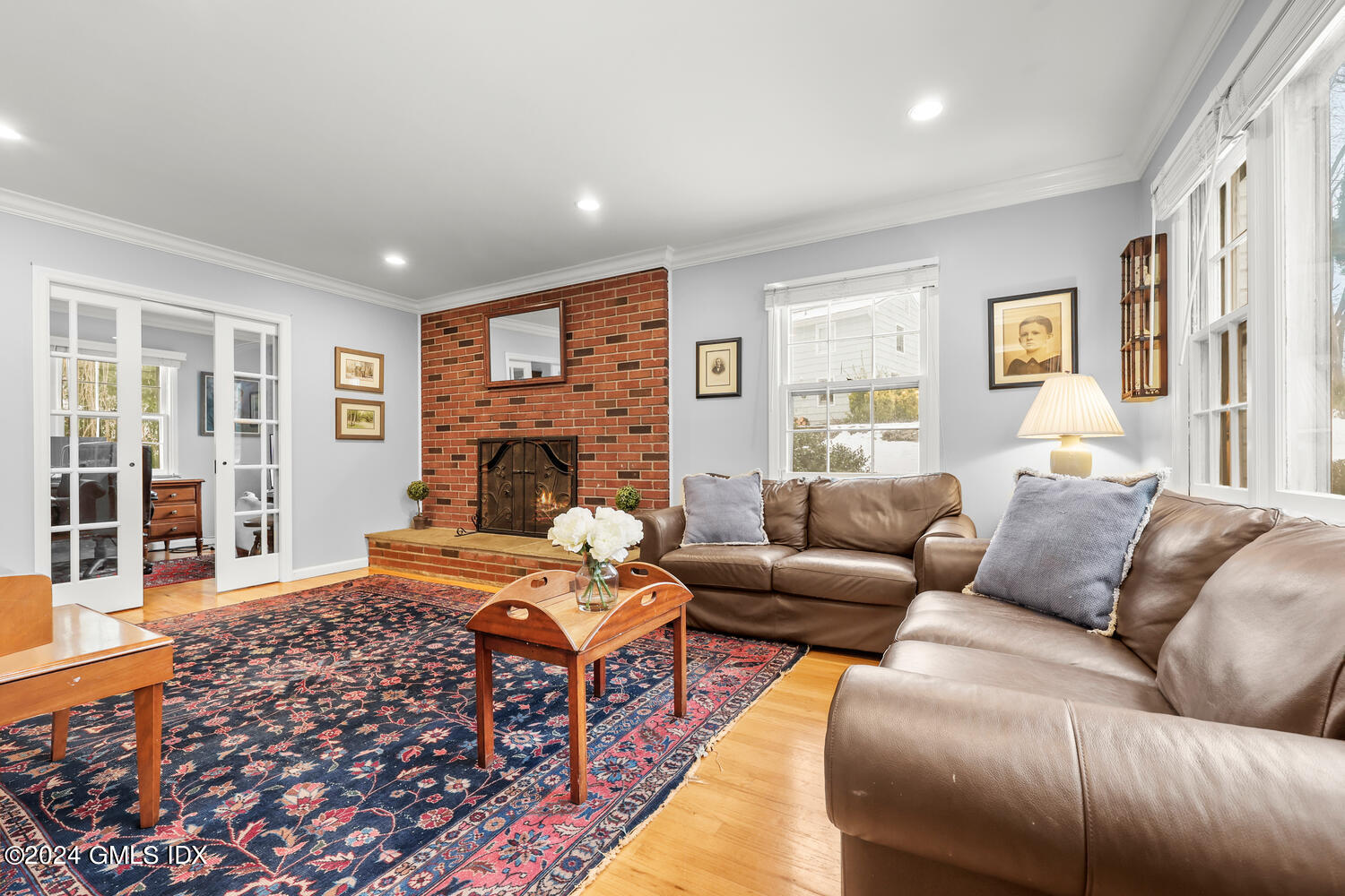 28 Juniper Lane Riverside, CT 06878 - Photo 3 of 22 a living room with furniture fireplace and flat screen tv