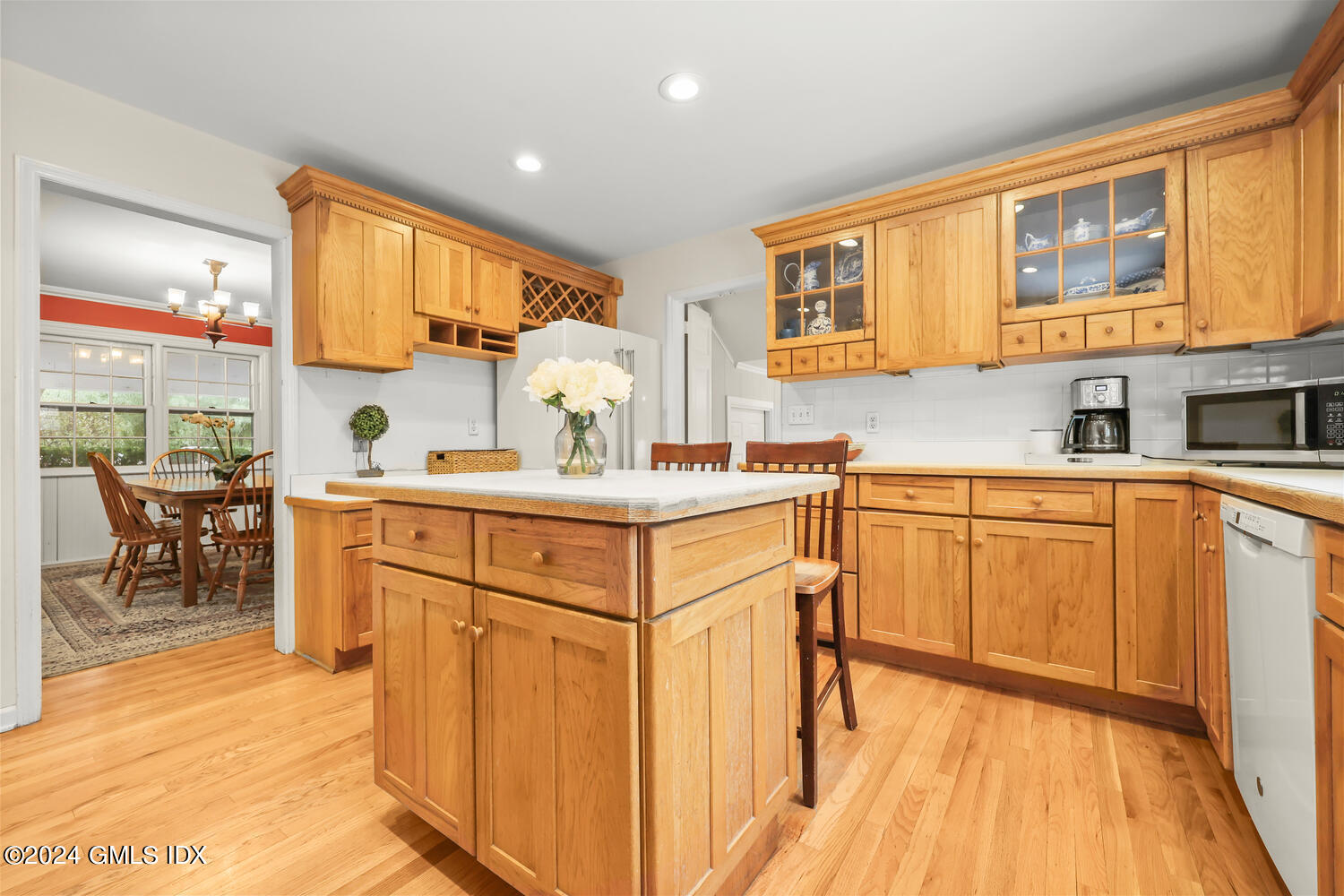 28 Juniper Lane Riverside, CT 06878 - Photo 7 of 22 a kitchen with stainless steel appliances granite countertop a sink cabinets and wooden floor