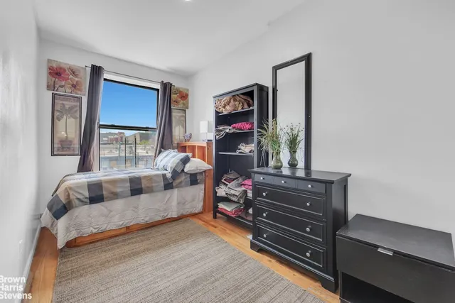 a bedroom with bed and a window