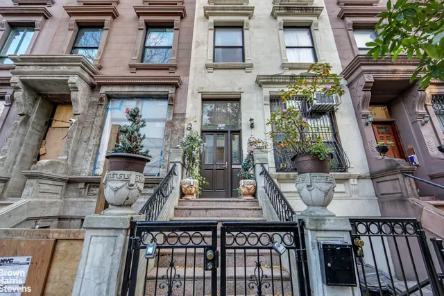 a view of balcony with wooden floor and outdoor seating