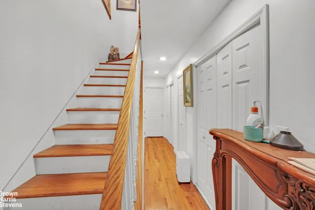 a living room with furniture and stairs
