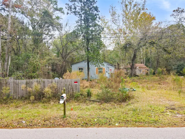 a view of swimming pool with a yard