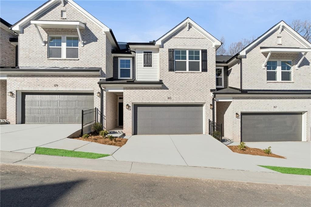 a front view of a house with yard