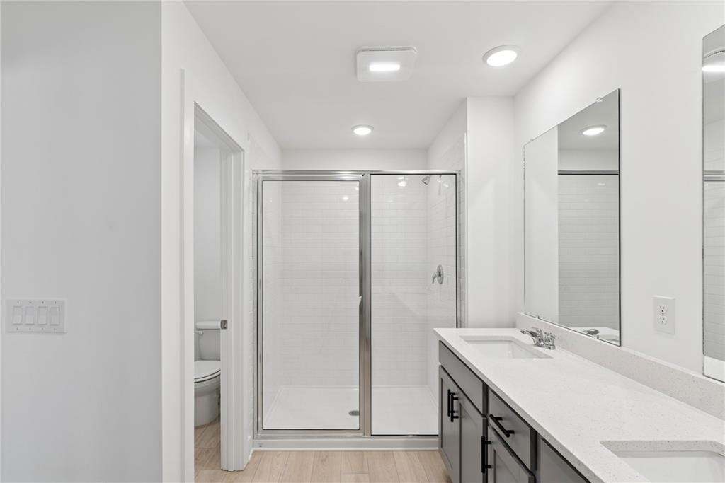 183 Redbud Road Canton, GA 30114 - Photo 11 of 16 a bathroom with a double vanity sink and mirror