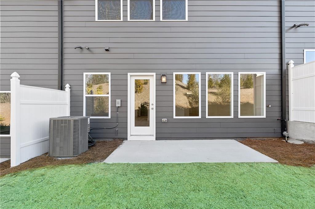 183 Redbud Road Canton, GA 30114 - Photo 2 of 16 a view of house with backyard and glass windows