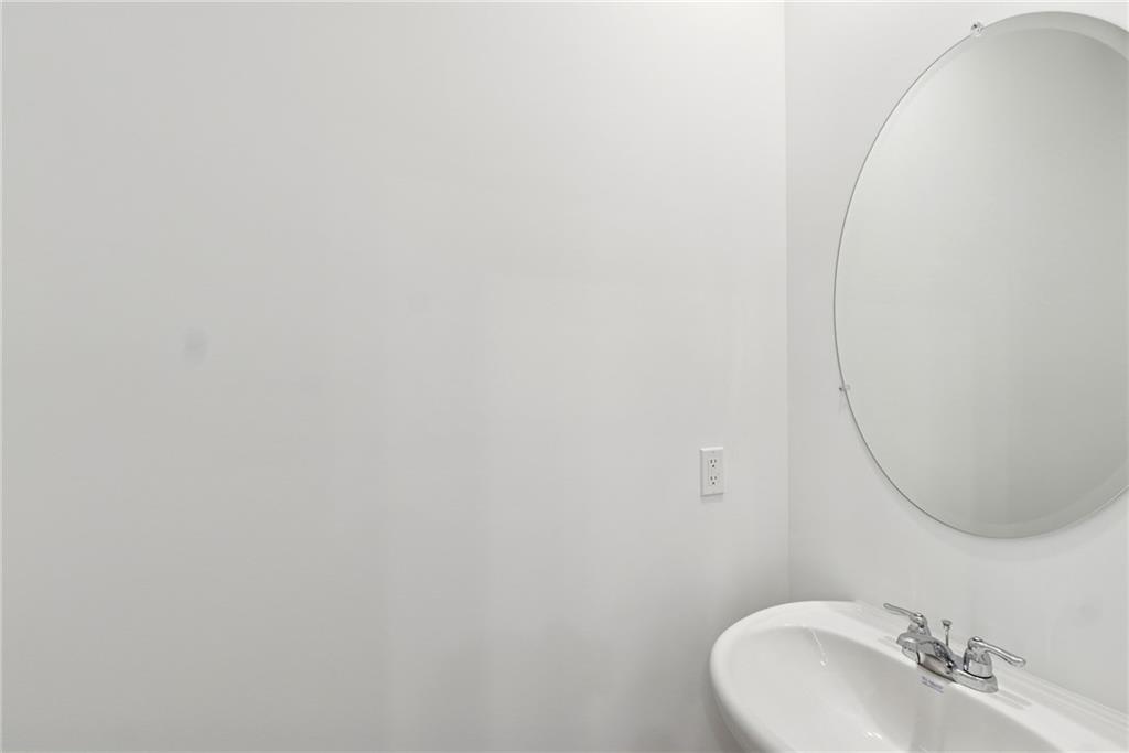 183 Redbud Road Canton, GA 30114 - Photo 9 of 16 a bathroom with a sink and a mirror