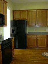 1518 Hubbard Court Fort Mill, SC 29708 - Photo 4 of 7 a kitchen with a refrigerator stove and microwave