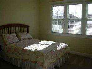 1518 Hubbard Court Fort Mill, SC 29708 - Photo 7 of 7 a bed sitting in a bedroom next to a window
