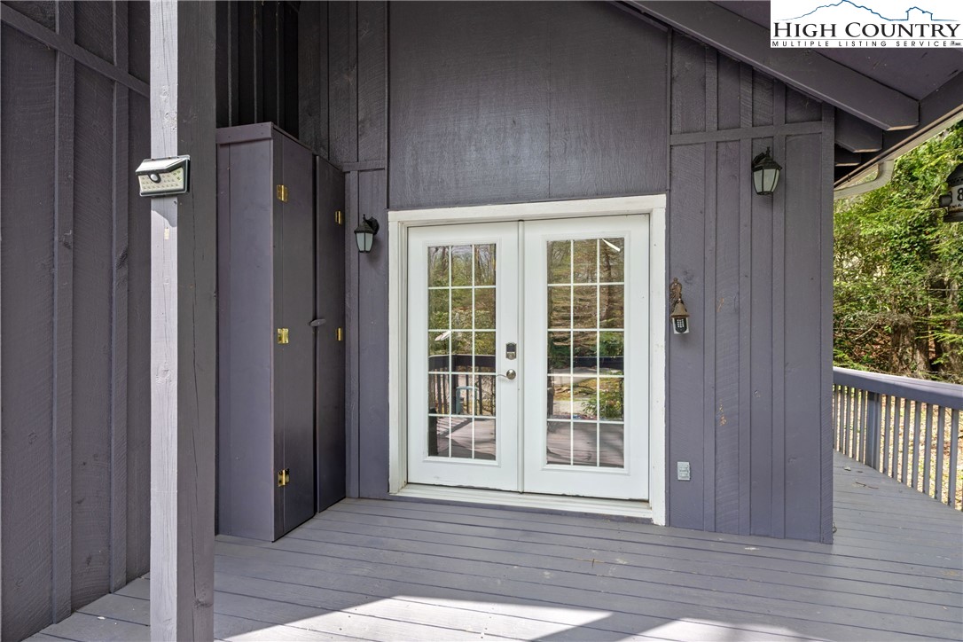 255 River Hollow Road Newland, NC 28657 - Photo 17 of 30 a view of a house with a glass door