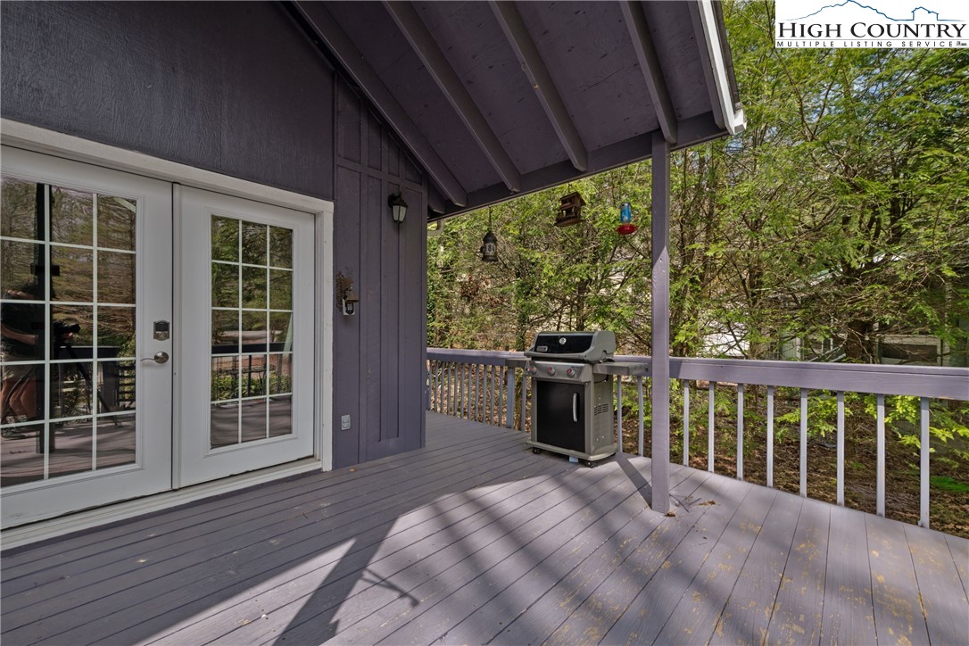 255 River Hollow Road Newland, NC 28657 - Photo 18 of 30 a view of balcony with furniture and garden