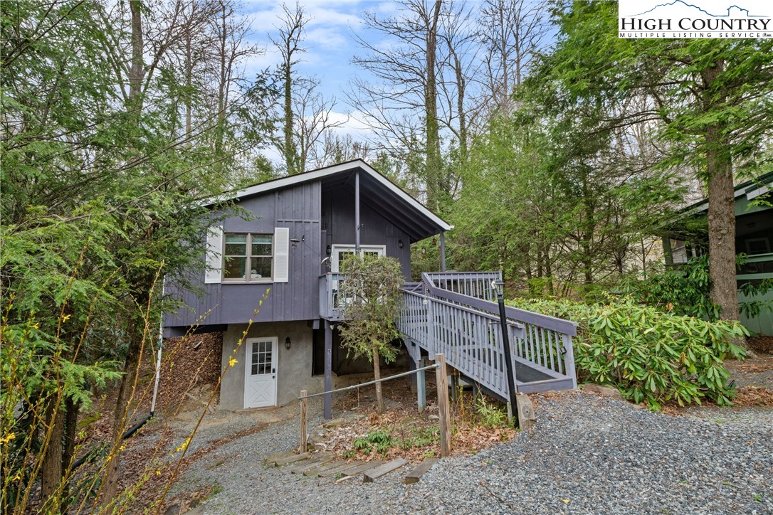255 River Hollow Road Newland, NC 28657 - Photo 25 of 30 a front view of a house with garden