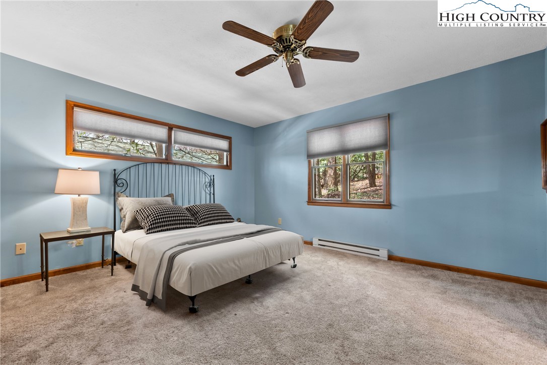 255 River Hollow Road Newland, NC 28657 - Photo 6 of 30 a bedroom with a bed and painting on the wall