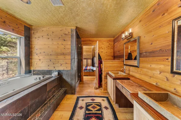 a bathroom with a bathtub and a window