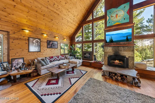 a living room with furniture a rug and a fireplace