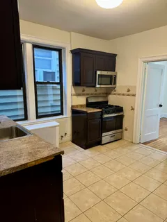 a kitchen with stainless steel appliances granite countertop a stove and a granite counter tops