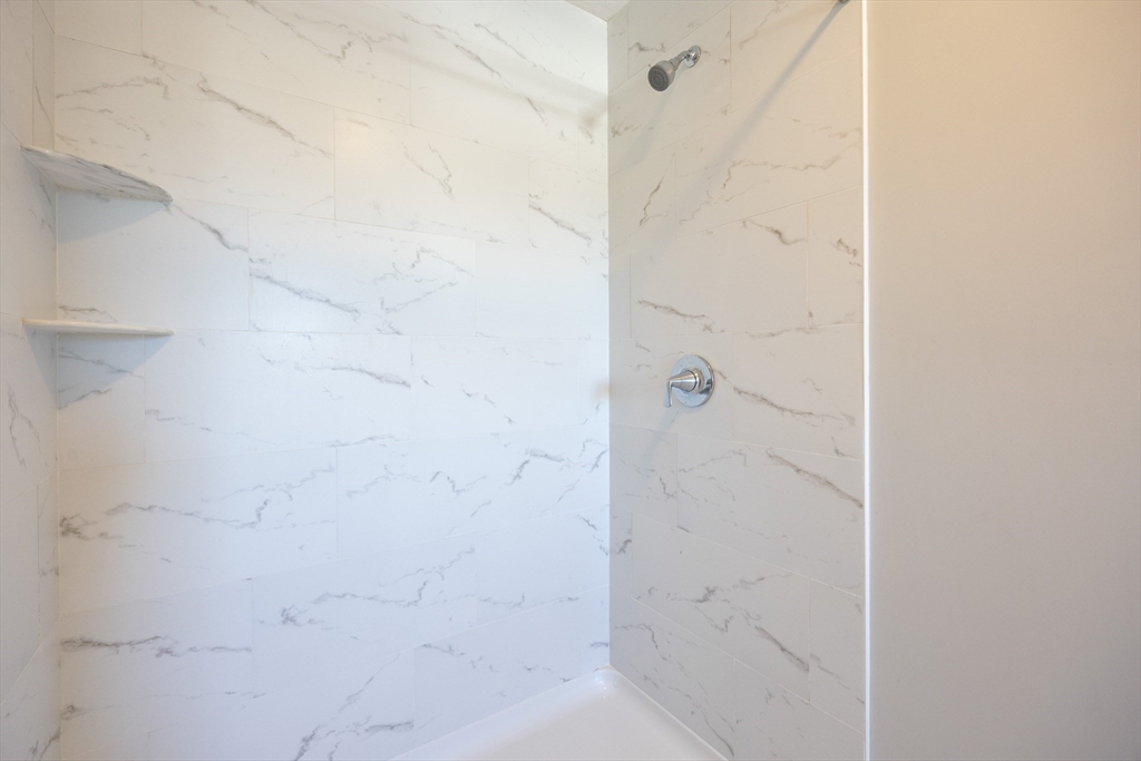 1 Clover Drive Bellingham, MA 02019 - Photo 21 of 34 a bathroom with a shower