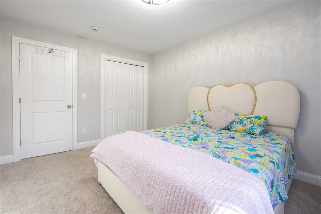 1 Clover Drive Bellingham, MA 02019 - Photo 22 of 34 a bedroom with bed and window