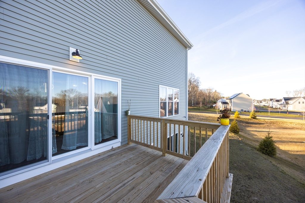 1 Clover Drive Bellingham, MA 02019 - Photo 30 of 34 a view of a balcony with wooden floor