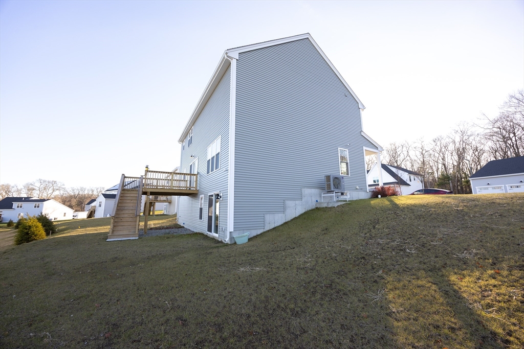 1 Clover Drive Bellingham, MA 02019 - Photo 31 of 34 a view of a house with a backyard