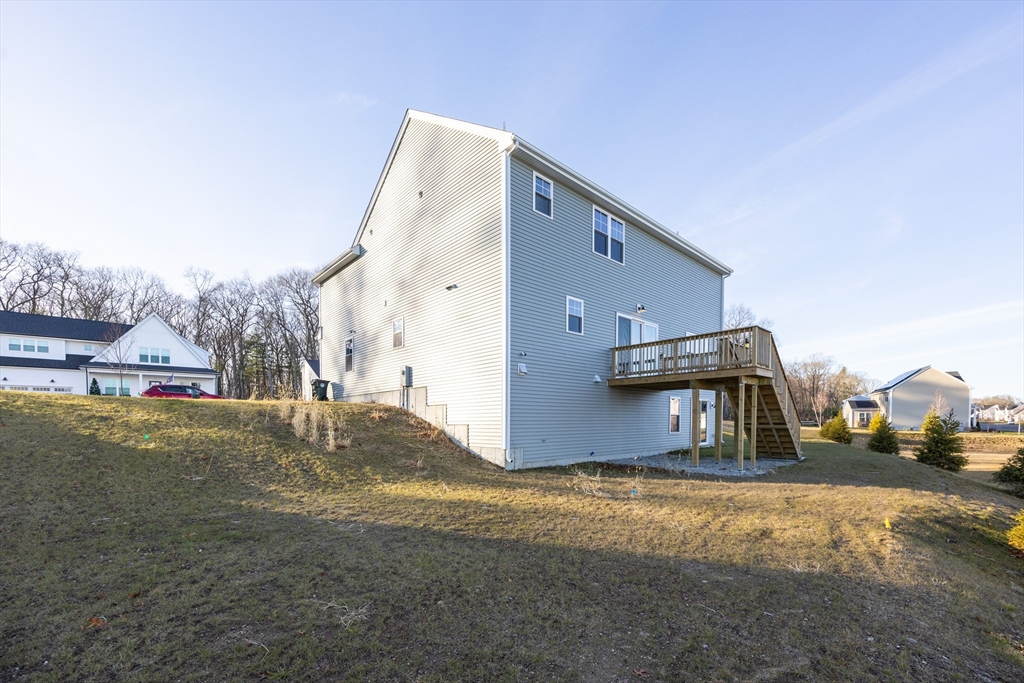 1 Clover Drive Bellingham, MA 02019 - Photo 32 of 34 a front view of a house with a yard