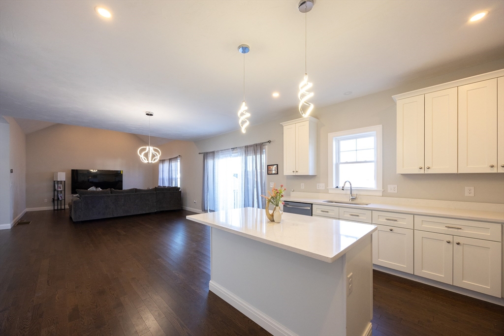 1 Clover Drive Bellingham, MA 02019 - Photo 8 of 34 a living room with furniture and a wooden floor