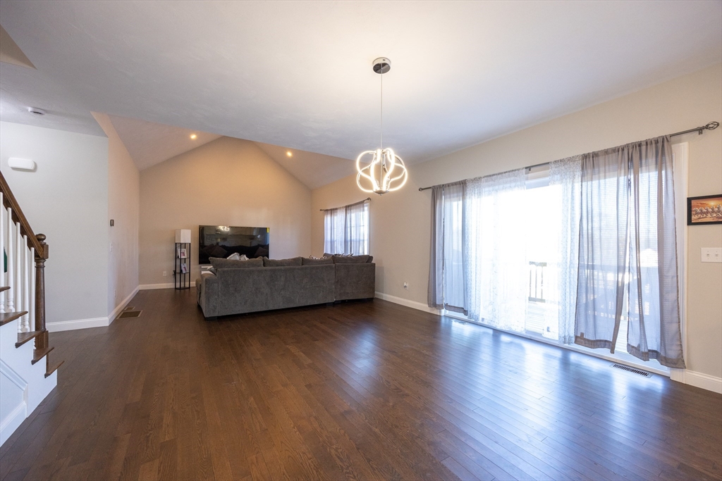 1 Clover Drive Bellingham, MA 02019 - Photo 9 of 34 a living room with furniture and a large window