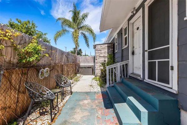 a bedroom with furniture and a chandelier