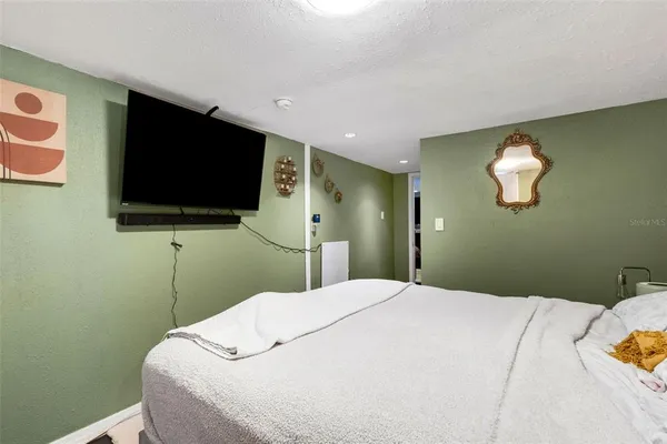 a play room with furniture and wooden floor