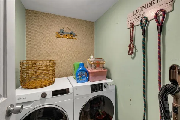 a kitchen with stainless steel appliances granite countertop a refrigerator and stove