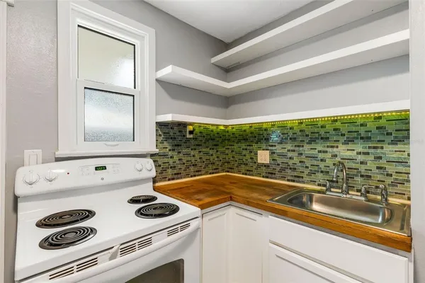 a view of washer and dryer with kitchen countertops