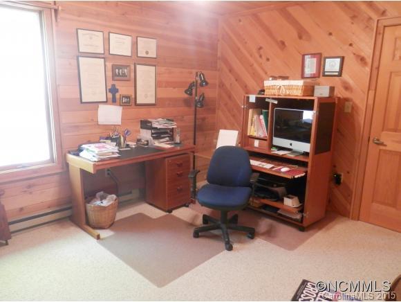 900 Mountain Cove Road Waynesville, NC 28786 - Photo 12 of 24 a reading room with furniture a rug and a window