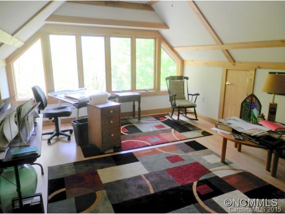 900 Mountain Cove Road Waynesville, NC 28786 - Photo 18 of 24 a view of a workspace with furniture and rug