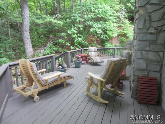 900 Mountain Cove Road Waynesville, NC 28786 - Photo 19 of 24 a view of a deck with wooden floor and outdoor seating