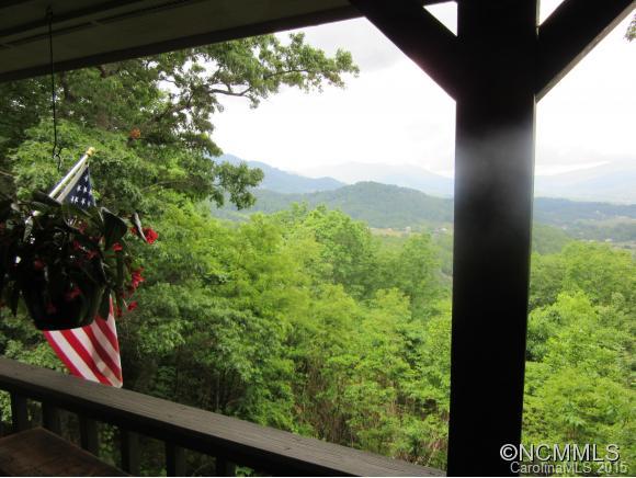 900 Mountain Cove Road Waynesville, NC 28786 - Photo 22 of 24 a view of a yard from a balcony