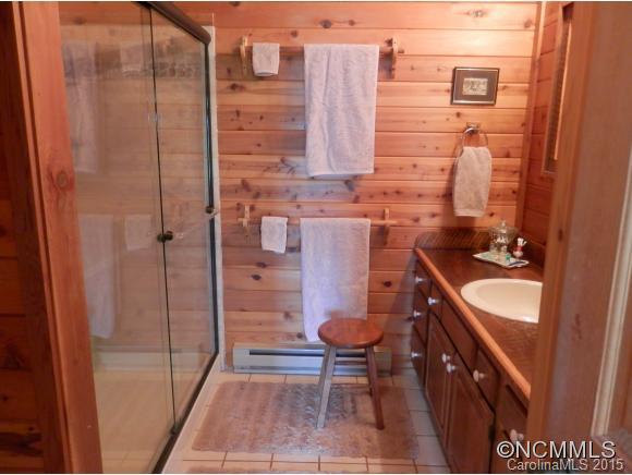 900 Mountain Cove Road Waynesville, NC 28786 - Photo 9 of 24 a bathroom with a sink and a mirror