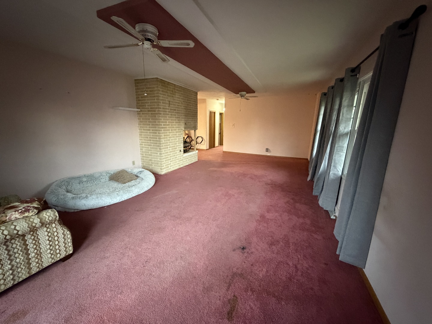 4019 5th Street East Moline, IL 61244 - Photo 11 of 37 a view of a livingroom with furniture and floor to ceiling window
