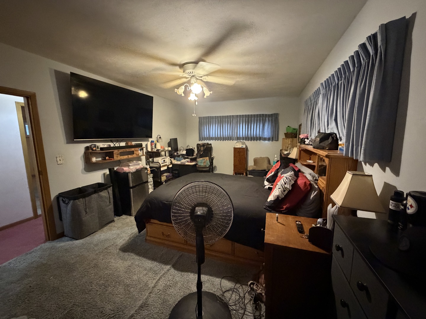 4019 5th Street East Moline, IL 61244 - Photo 13 of 37 a living room with furniture a flat screen tv and a window