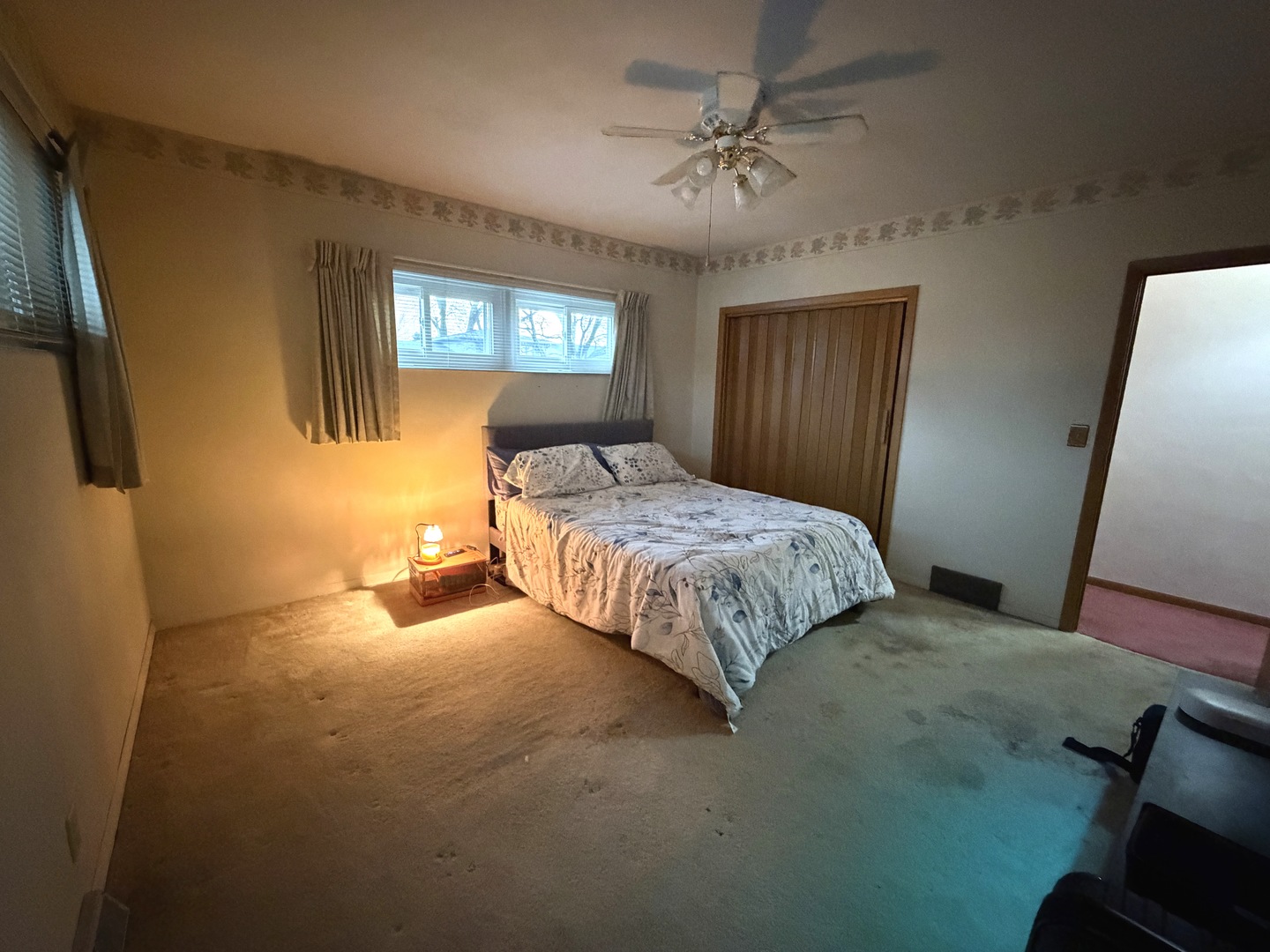 4019 5th Street East Moline, IL 61244 - Photo 16 of 37 a bedroom with a bed and a potted plant on dresser