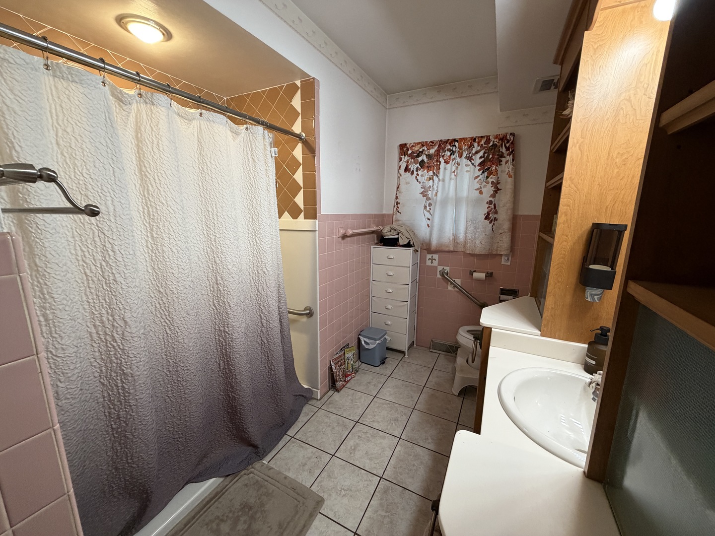 4019 5th Street East Moline, IL 61244 - Photo 21 of 37 a bathroom with a toilet and a shower curtain