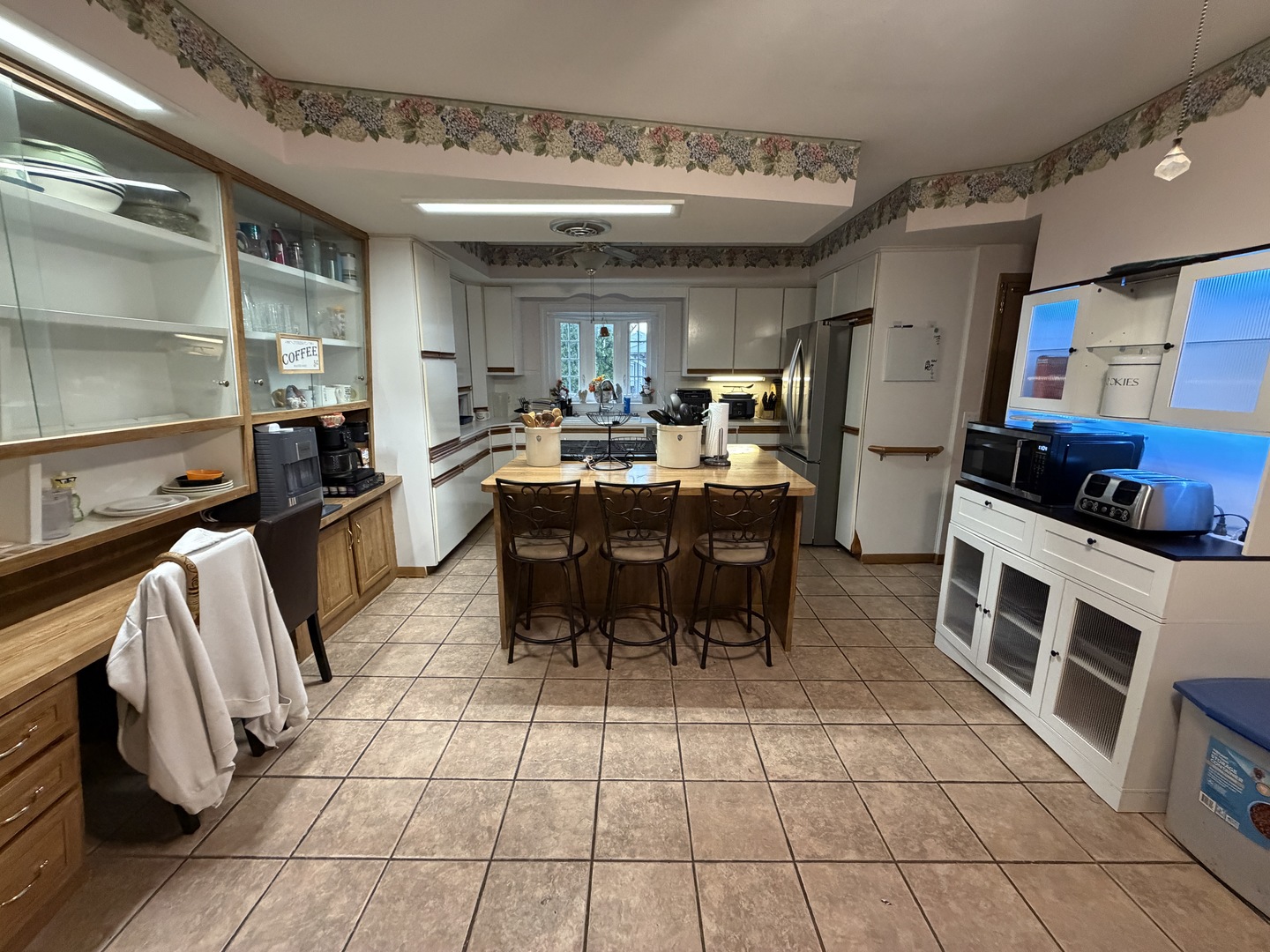 4019 5th Street East Moline, IL 61244 - Photo 5 of 37 a kitchen with stainless steel appliances kitchen island granite countertop a sink and cabinets