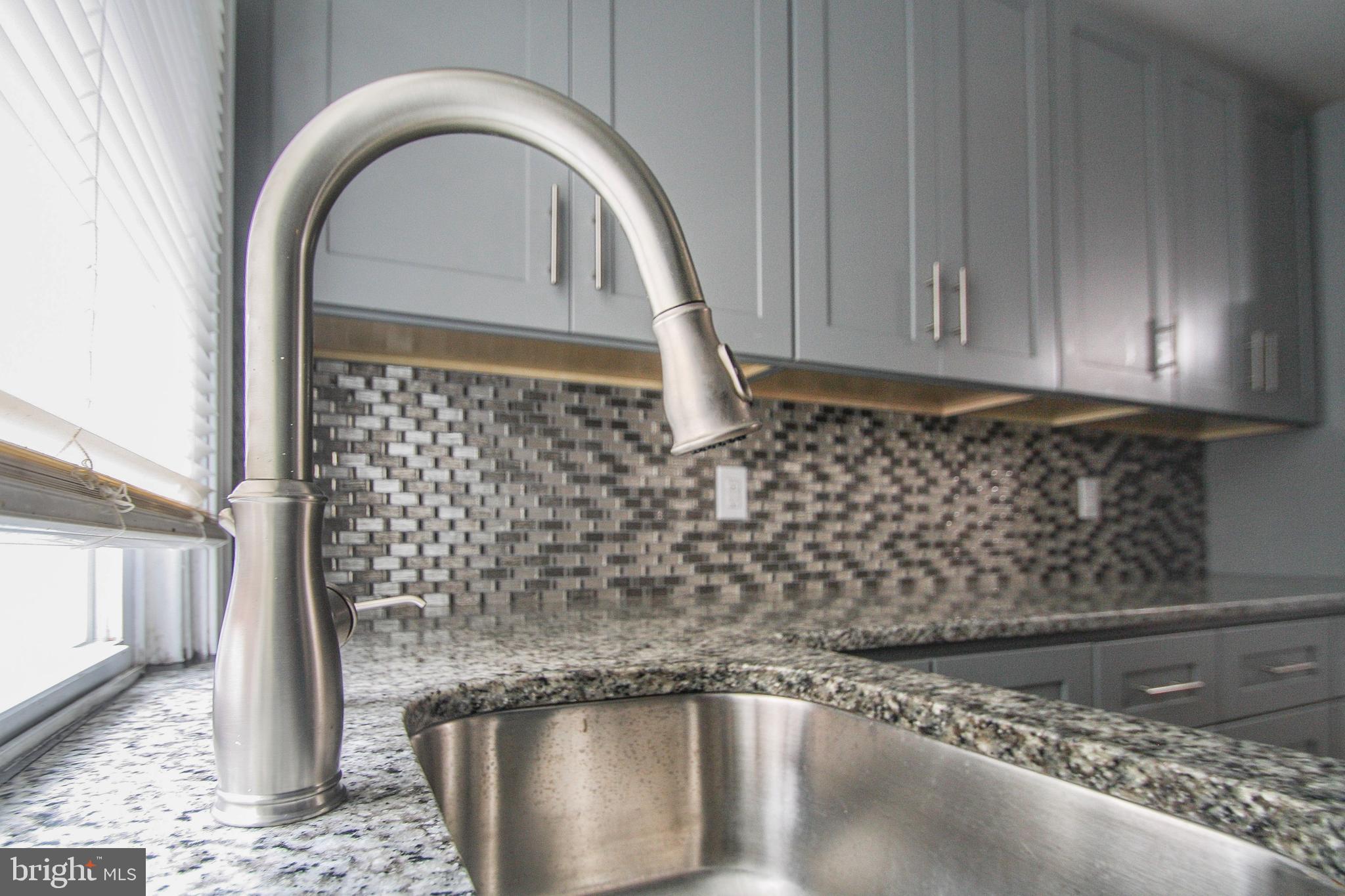 268 Sanford Road Upper Darby, PA 19082 - Photo 12 of 25 a close view of a sink a faucet and a window