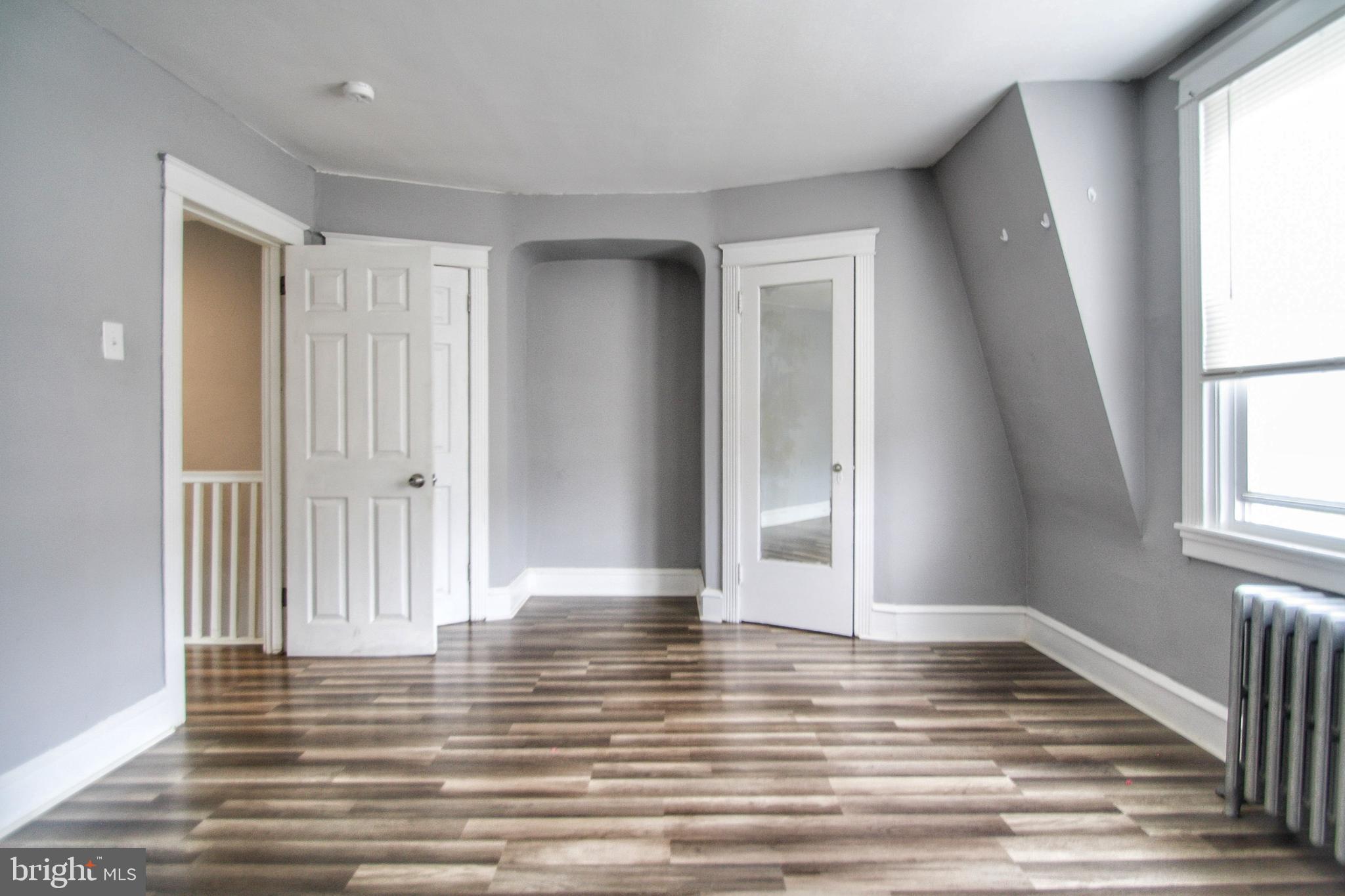 268 Sanford Road Upper Darby, PA 19082 - Photo 14 of 25 a view of empty room with wooden floor and fan