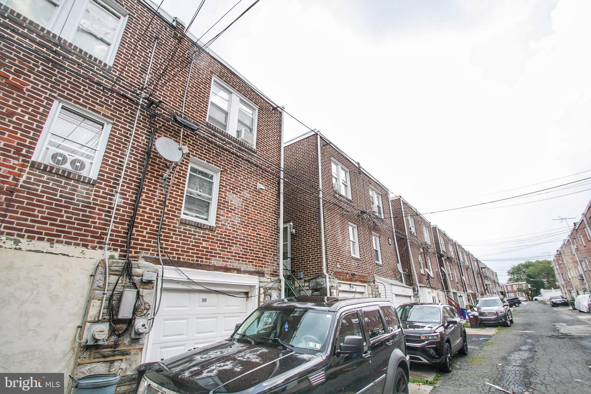 268 Sanford Road Upper Darby, PA 19082 - Photo 25 of 25 a city street lined with parked cars and buildings